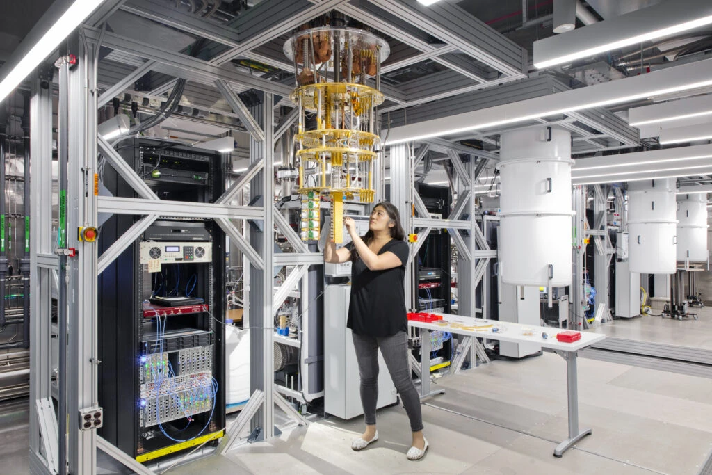 An IBM employee working on quantum computing hardware inside a data center